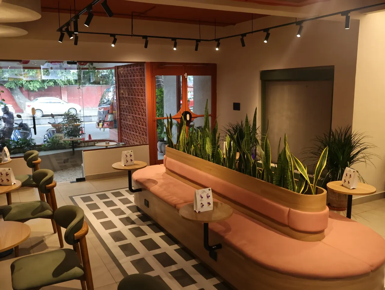 Gather Around - Curved coral seating and a ribbon of greenery shape a comfortable space for long conversations.