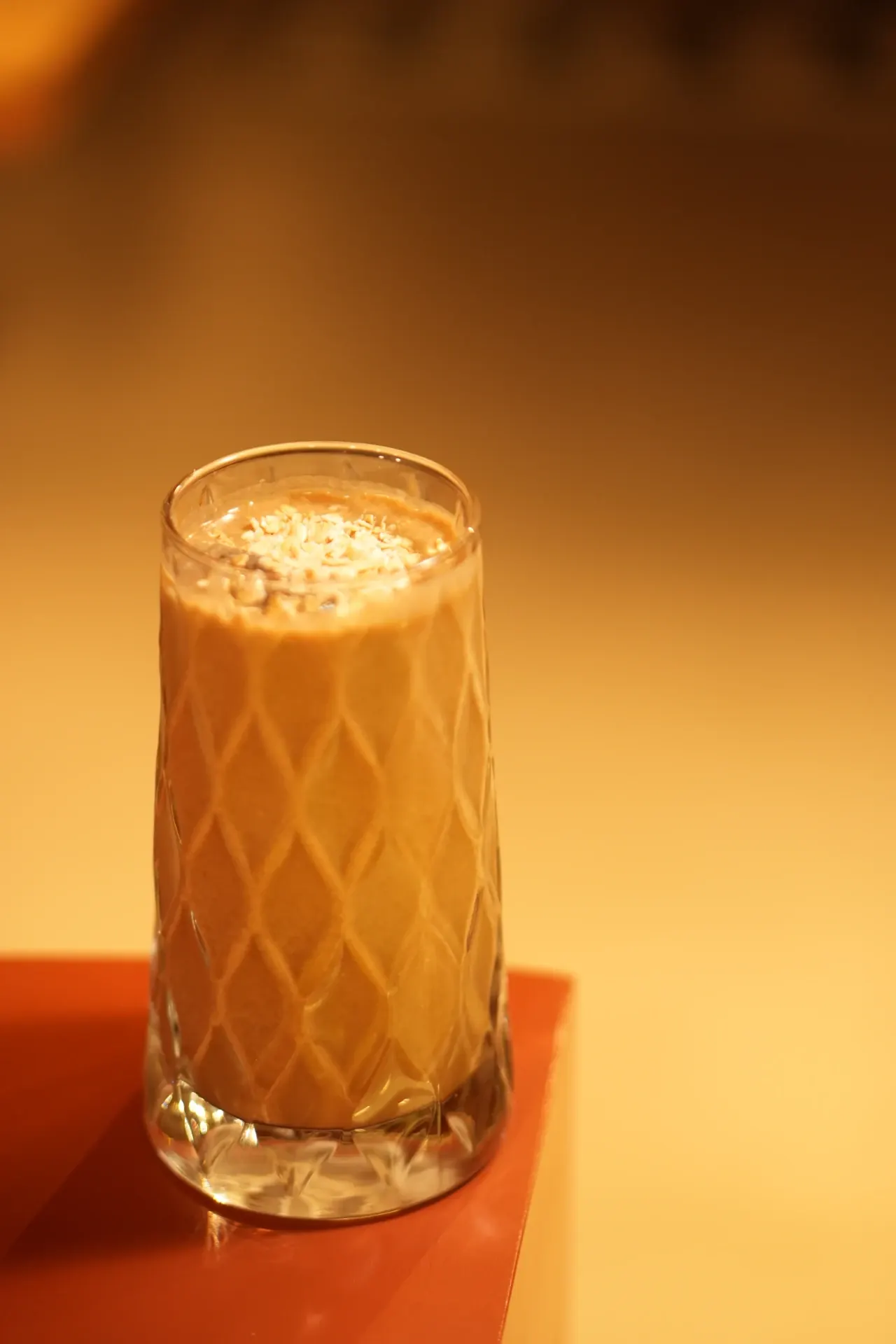 Coffee, Chilled - A tall cold coffee poured over ice and finished with a delicate topping.